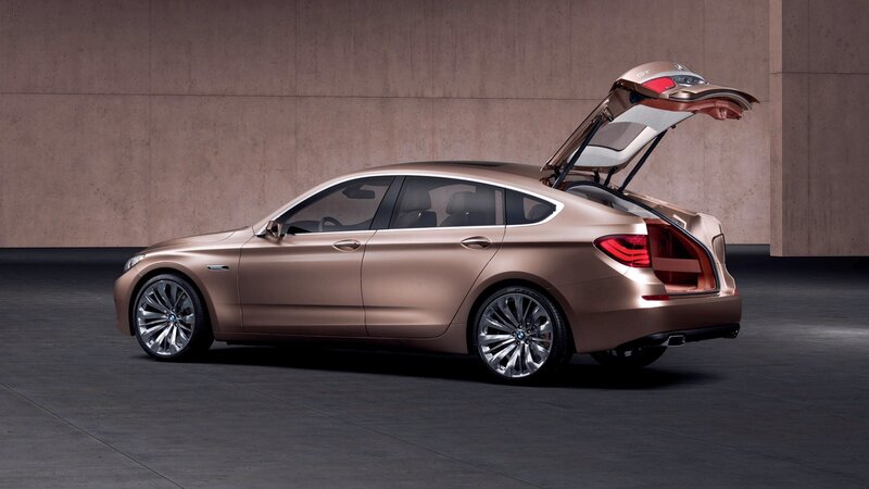 bronze concept car with open trunk