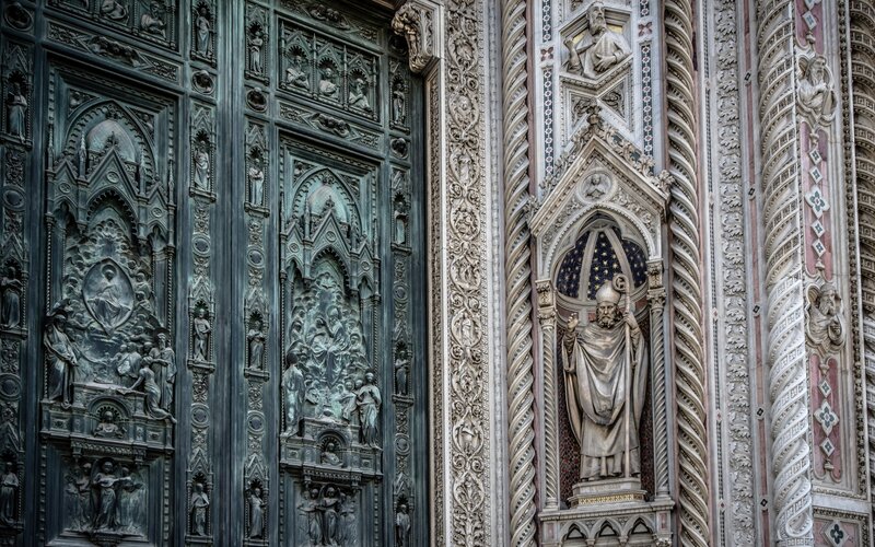 Bronze Doors and Stone Statue