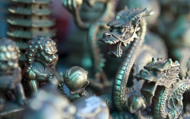 Bronze figurines of dragons and lions