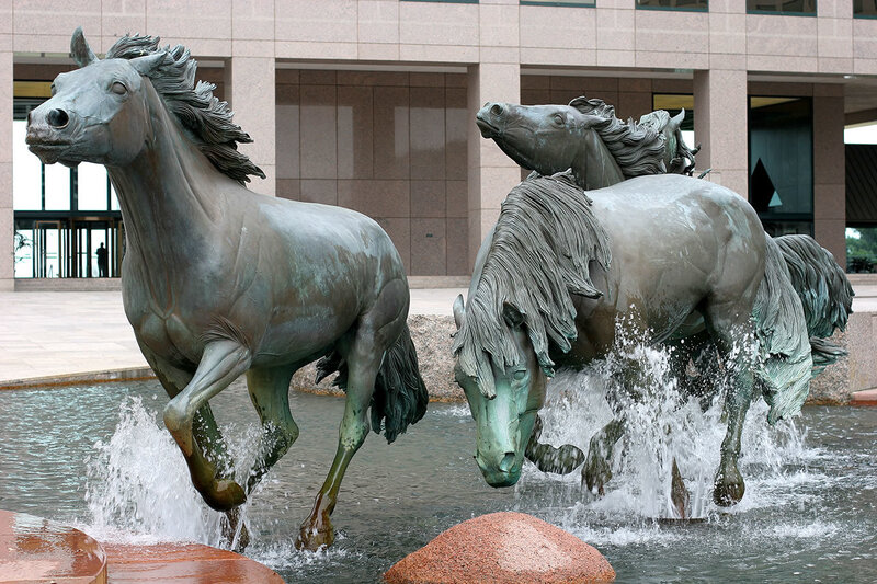Bronze horse statues in fountain