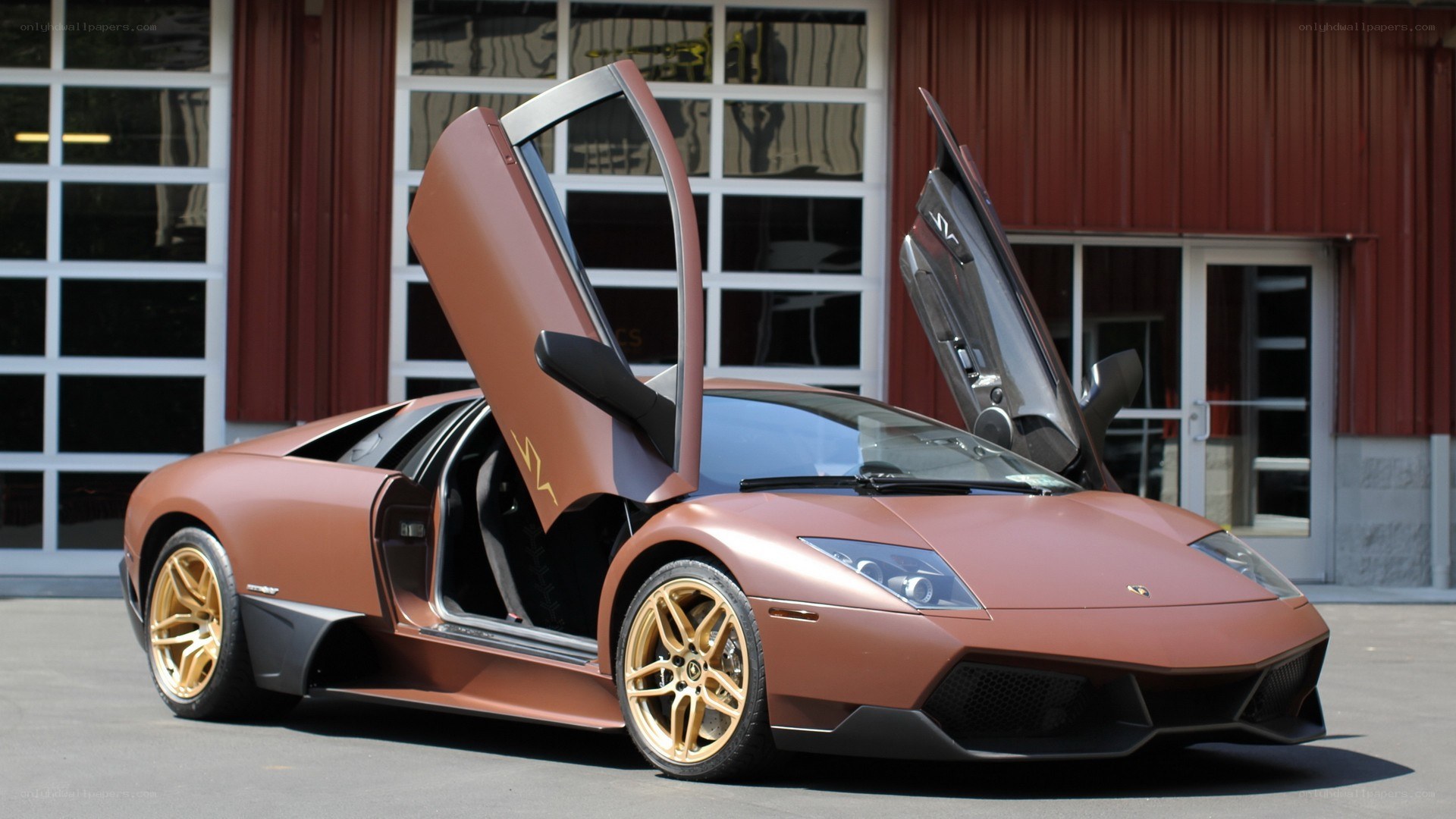 bronze Lamborghini with doors open