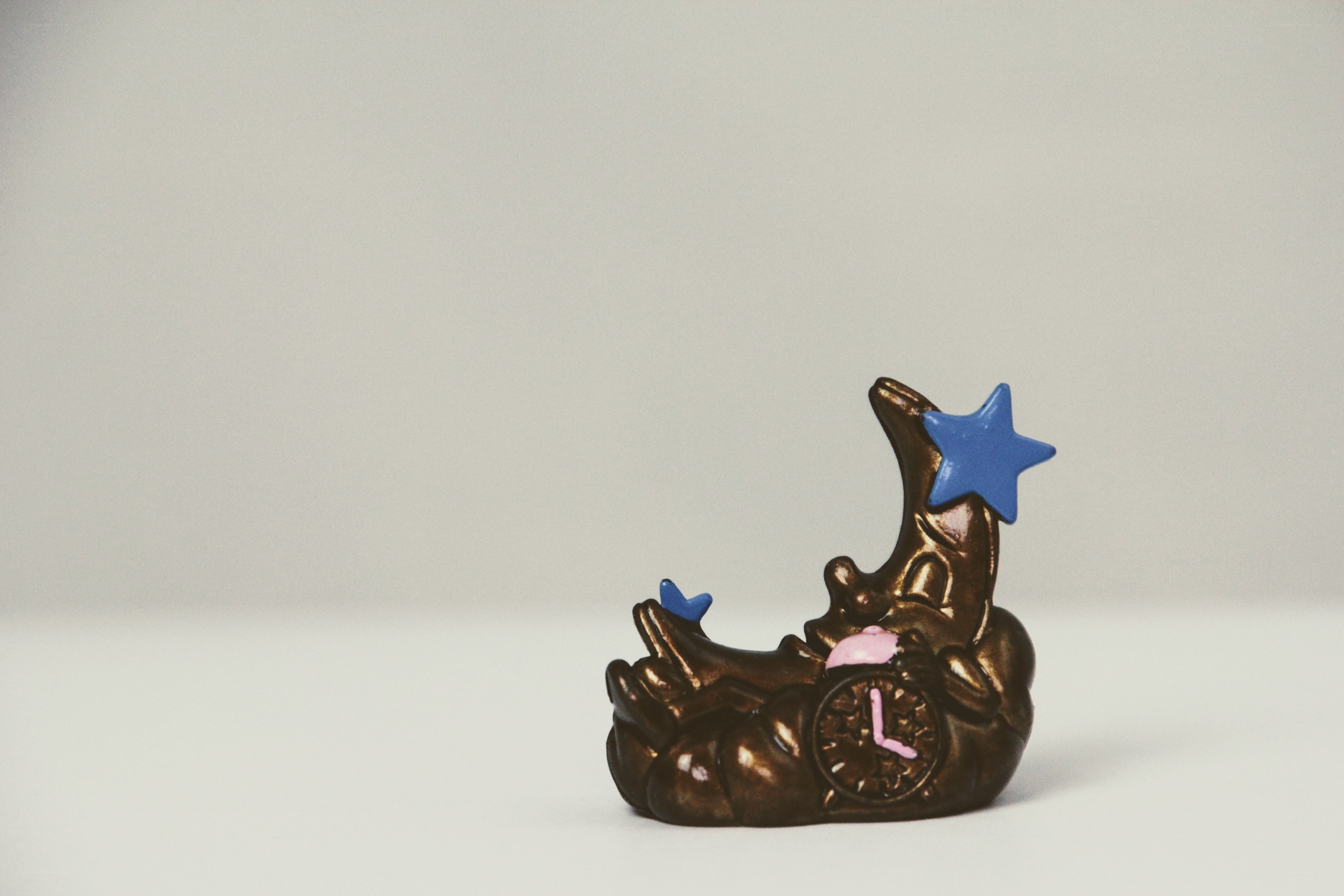 Bronze moon figurine with stars