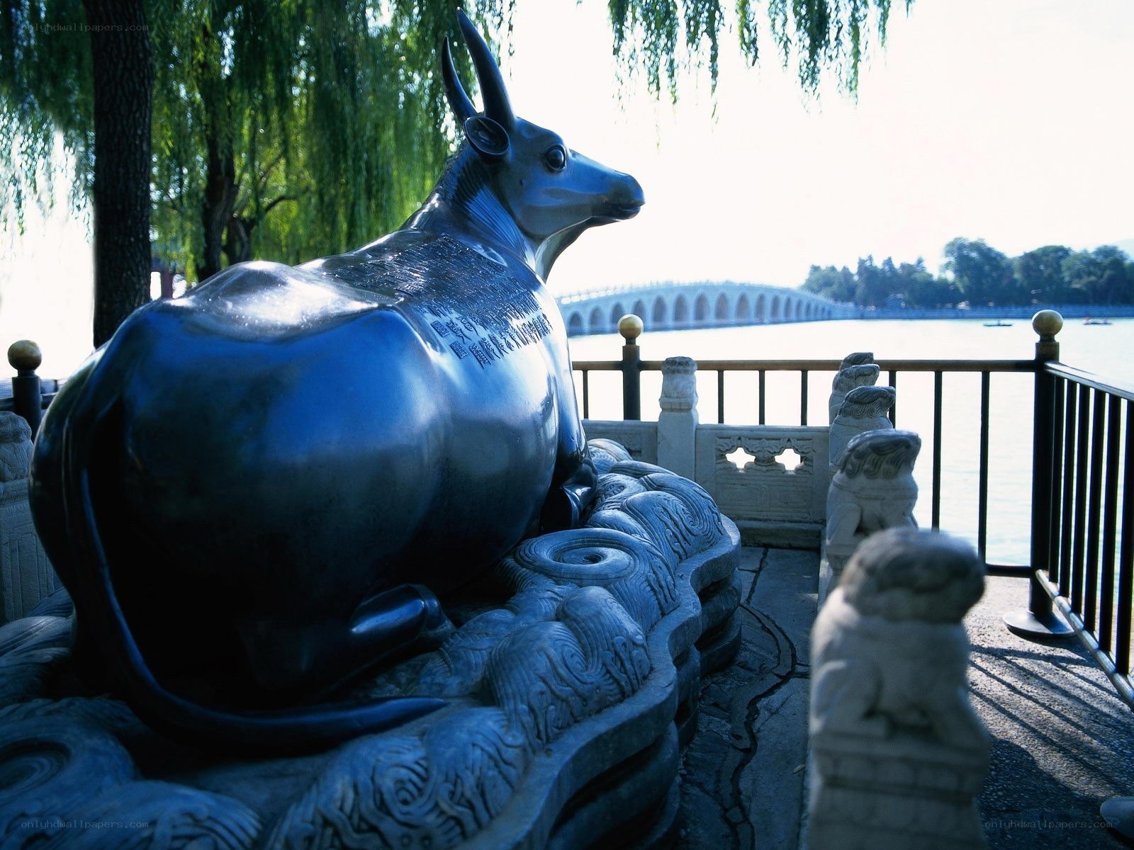 Bronze ox statue by the lake
