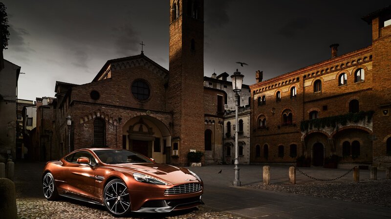 Bronze Sports Car — Brown, Dramatic, Night, Photograph, Brick Buildings, Church