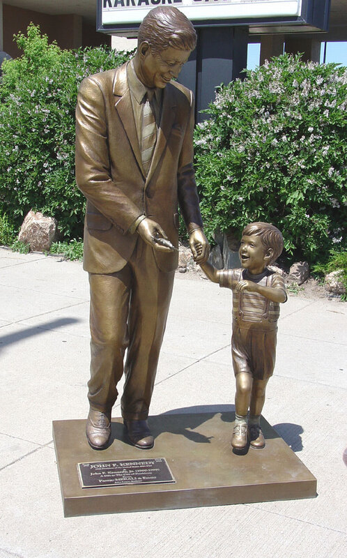 Bronze statue of JFK and child