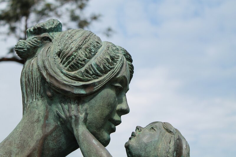 bronze statue of mother and child