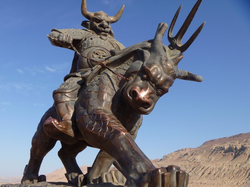 Bronze statue of warrior on beast