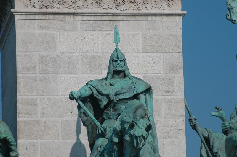 bronze statue on stone pillar