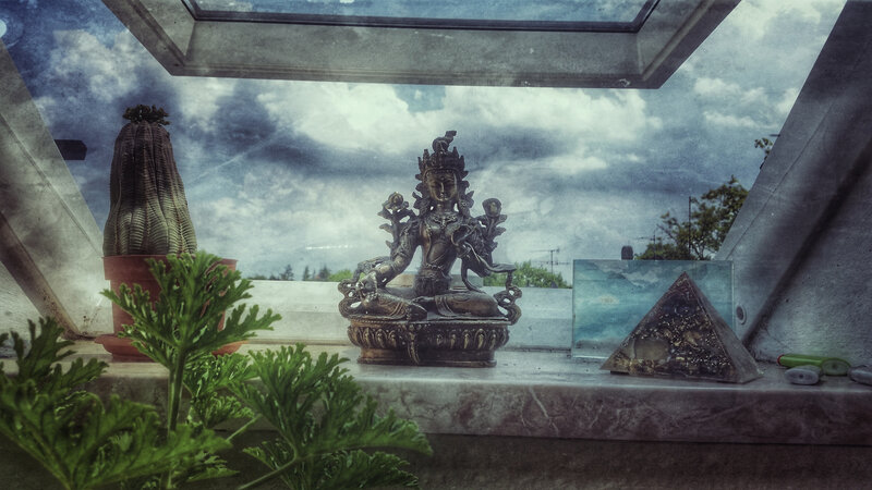 Bronze Statue on Windowsill