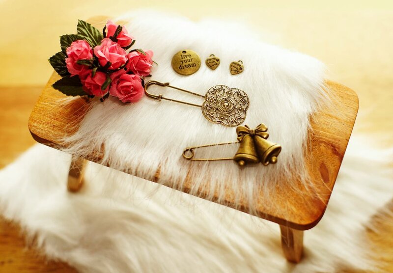 Brooches on Wooden Stool