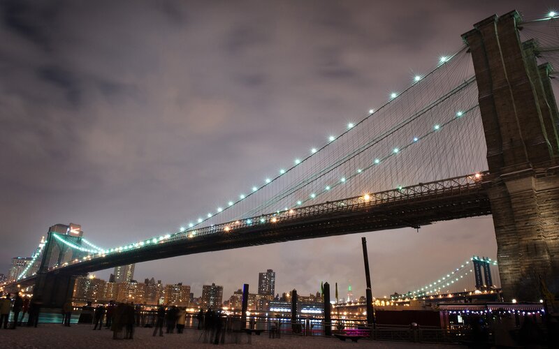 Brooklyn Bridge at Night — Black, Dramatic, Photograph, City Skyline, People, River