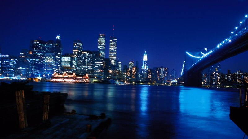 Brooklyn Bridge at Night — Blue, Calm, Photograph, City Skyline, River, Boat