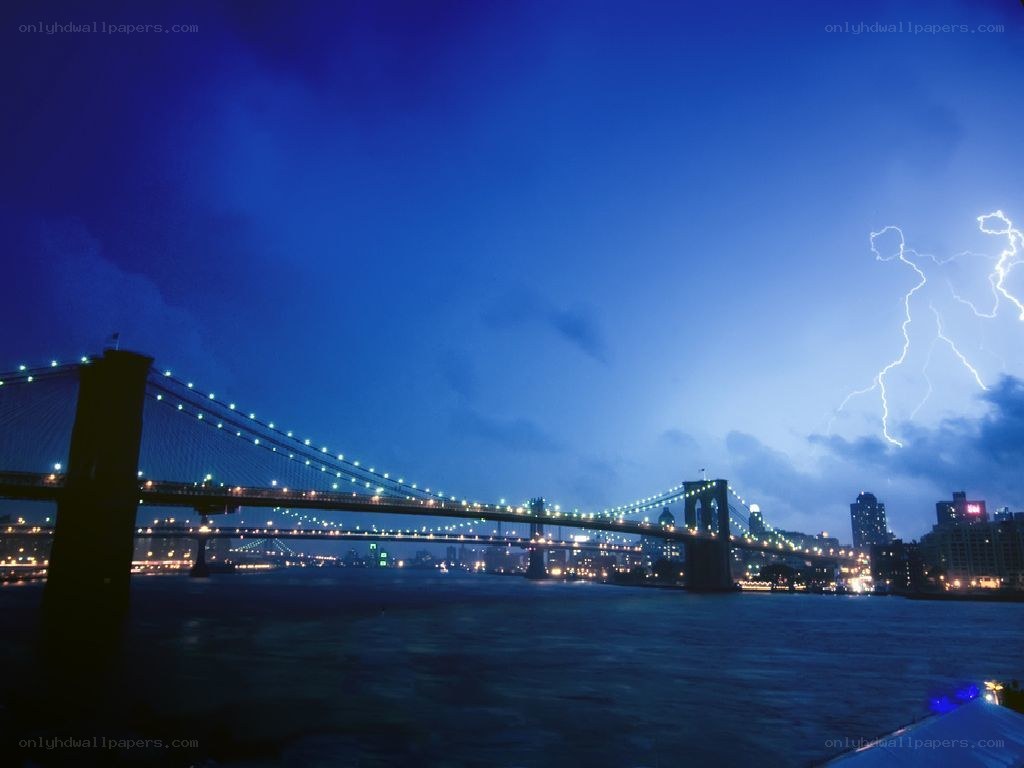 Brooklyn Bridge at night with lightning