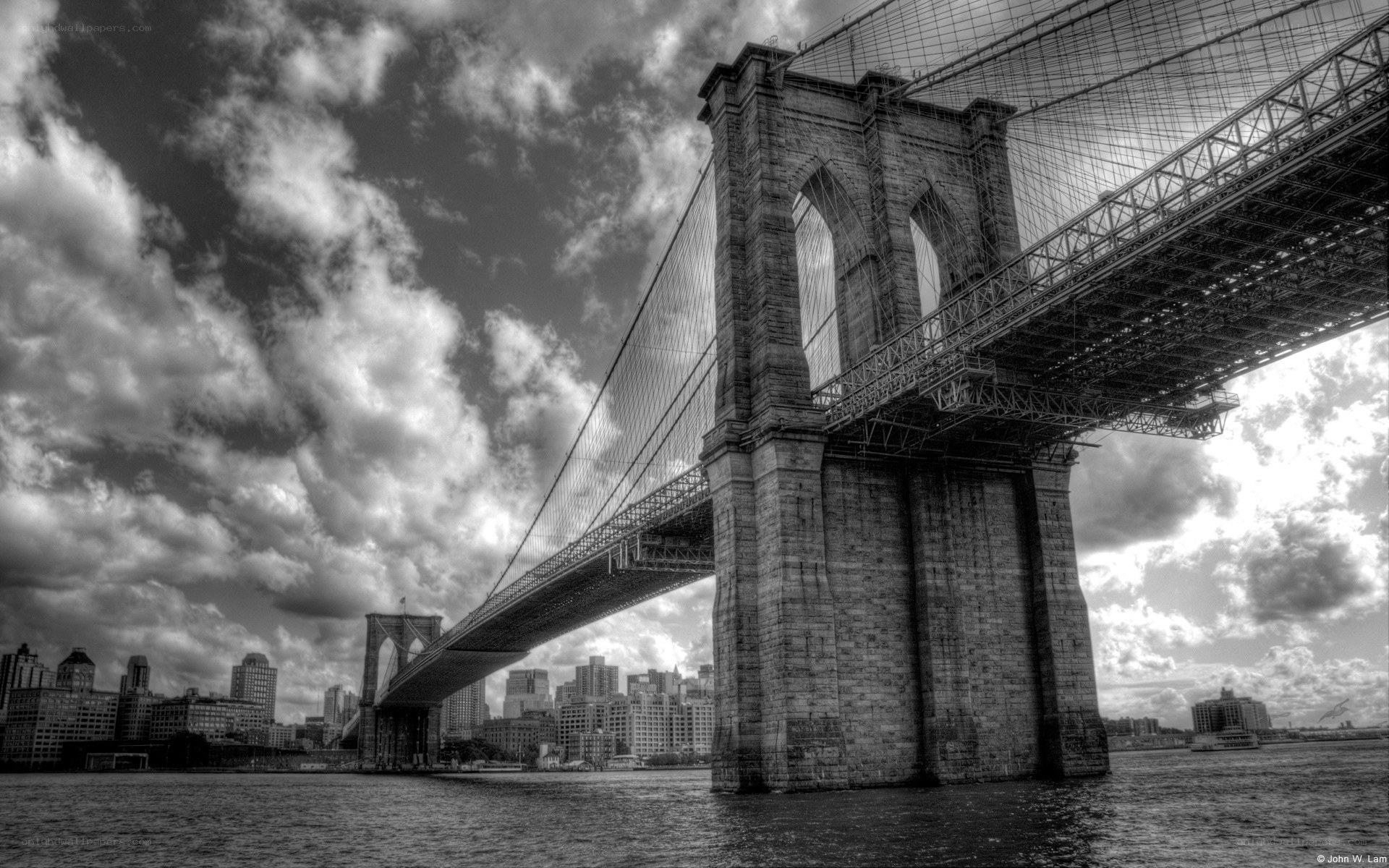 Brooklyn Bridge under cloudy sky