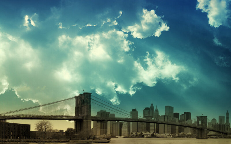 Brooklyn Bridge under dramatic sky