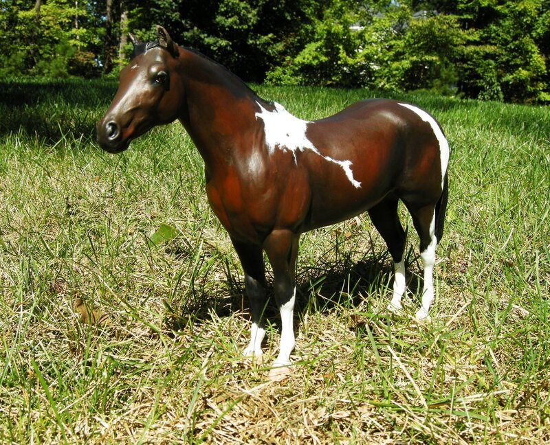 brown and white horse figurine