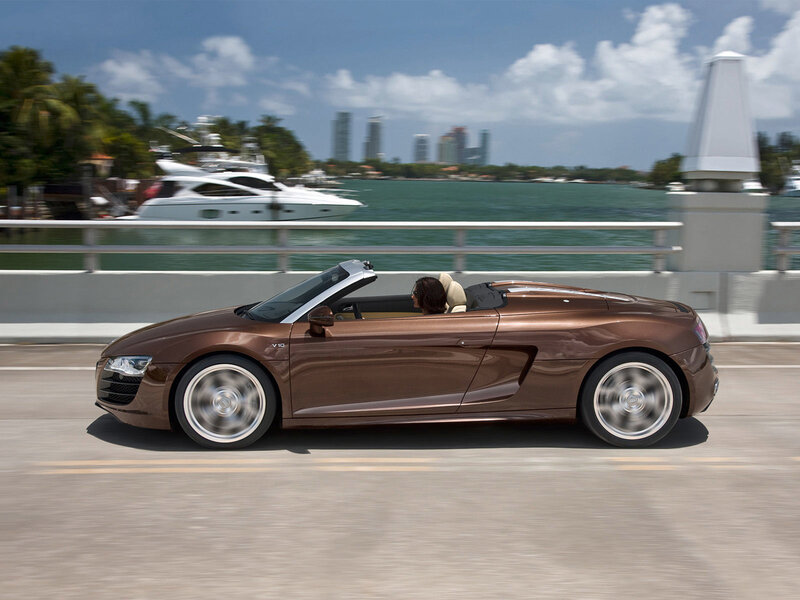 Brown Audi R8 convertible on a bridge