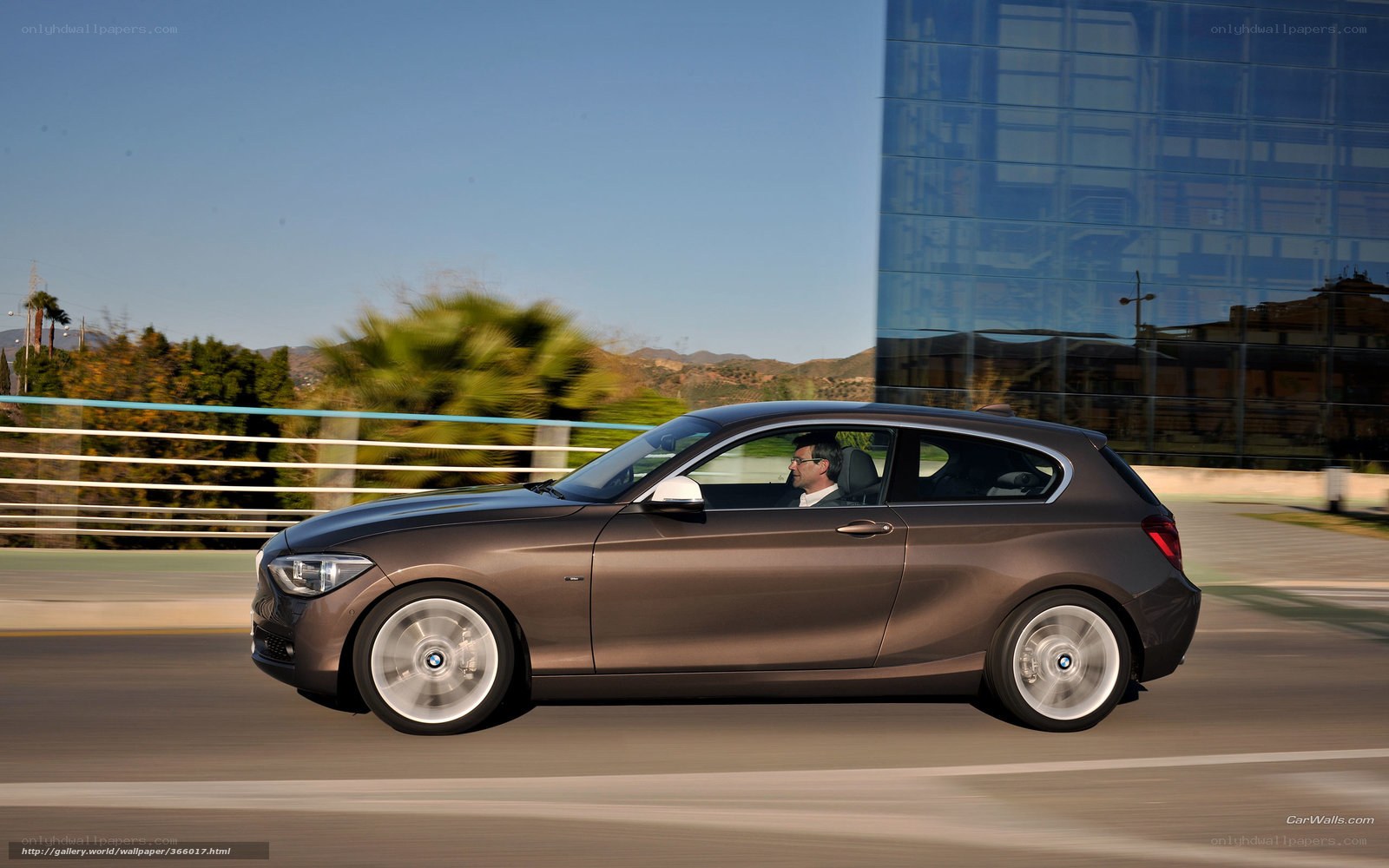brown bmw 1-series in motion