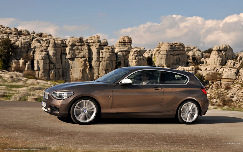 Brown BMW 1 Series on a road