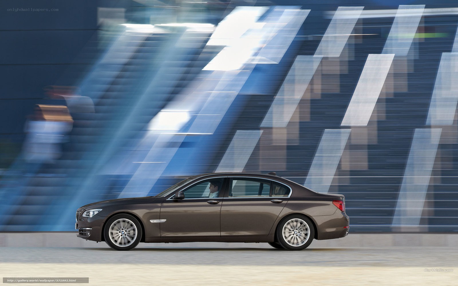 Brown BMW 7 Series in motion