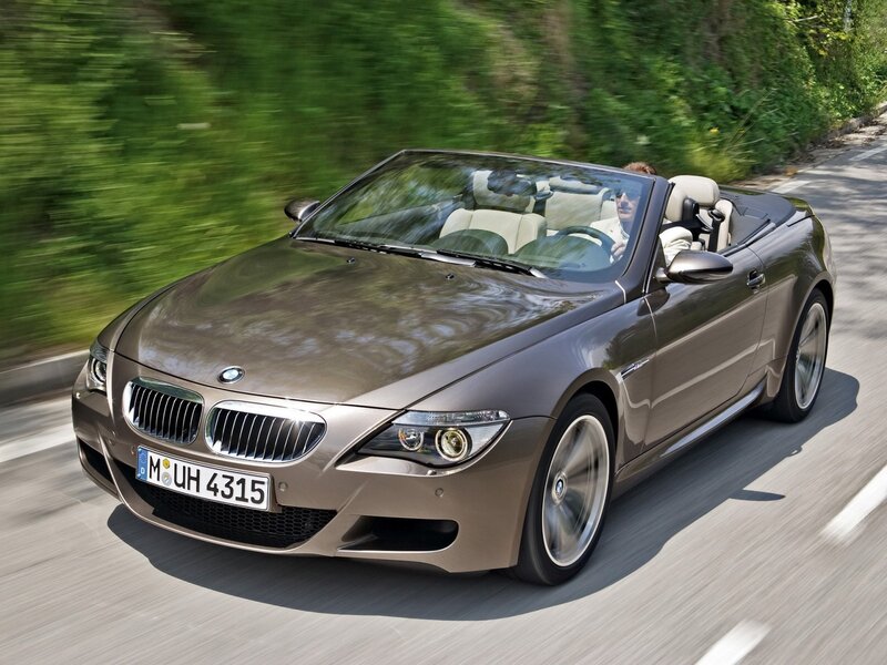 Brown BMW convertible driving