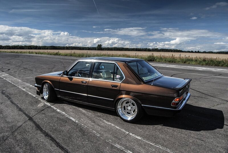 Brown BMW sedan on track