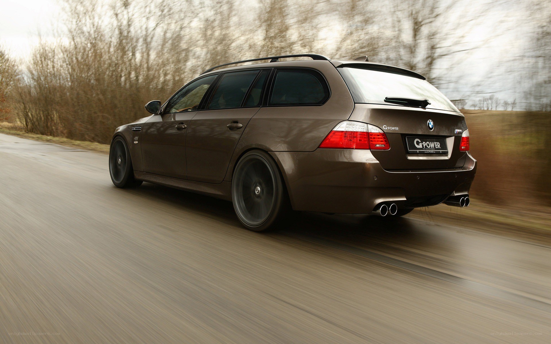 brown bmw station wagon in motion