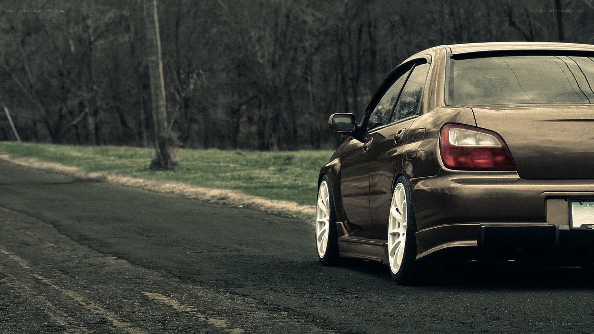 brown car on a country road