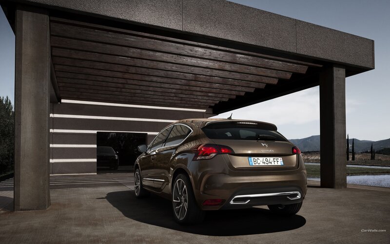 Brown Citroën DS4 parked under a carport
