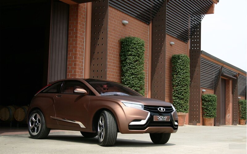 Brown concept car in front of building