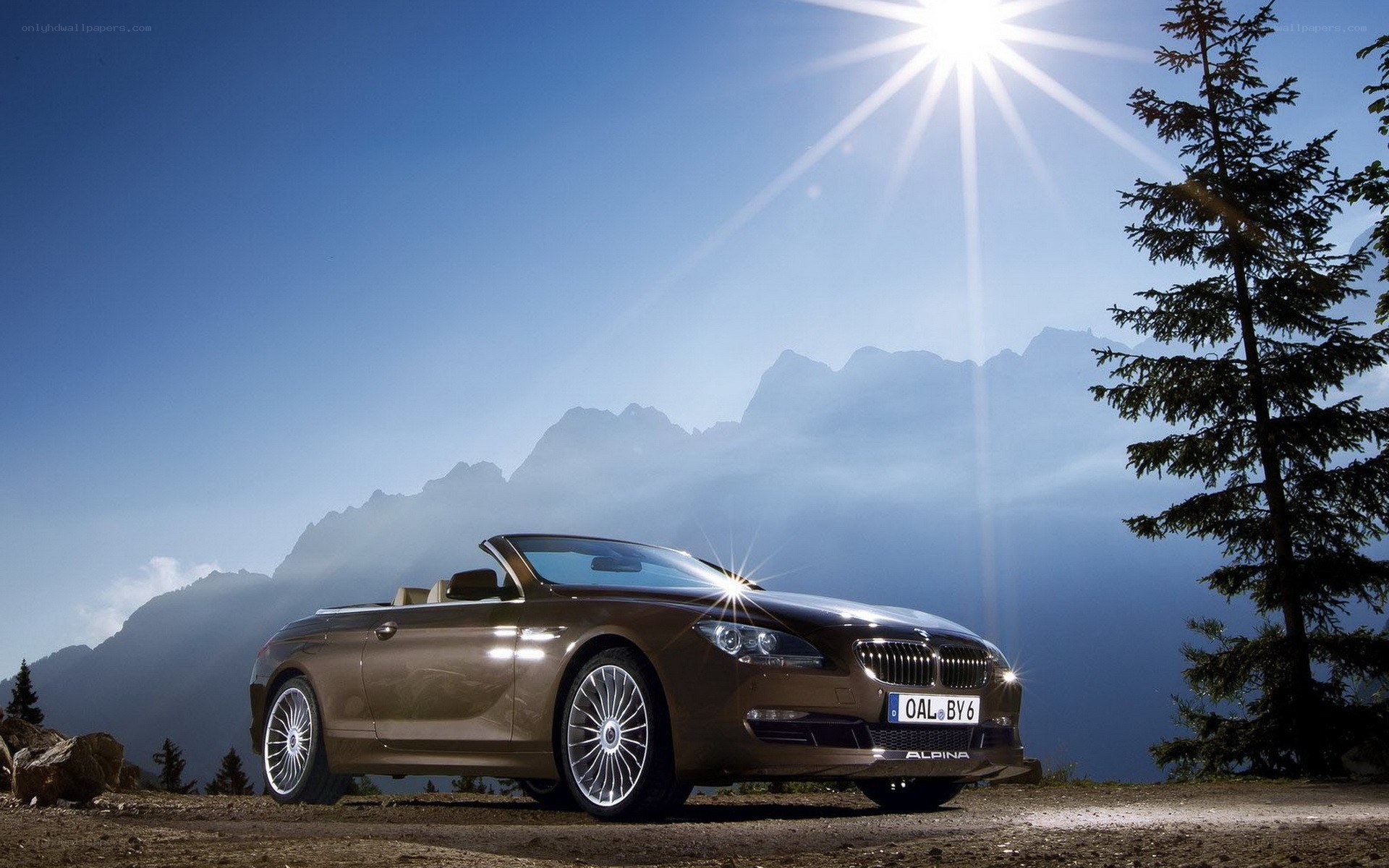 Brown convertible car in mountains