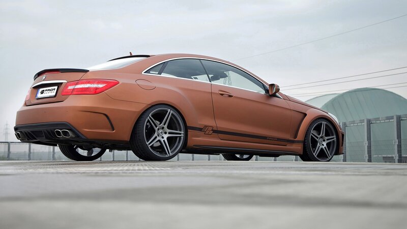brown coupe car with custom wheels