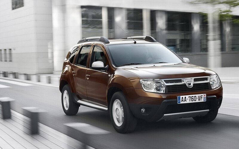 Brown Dacia SUV in motion
