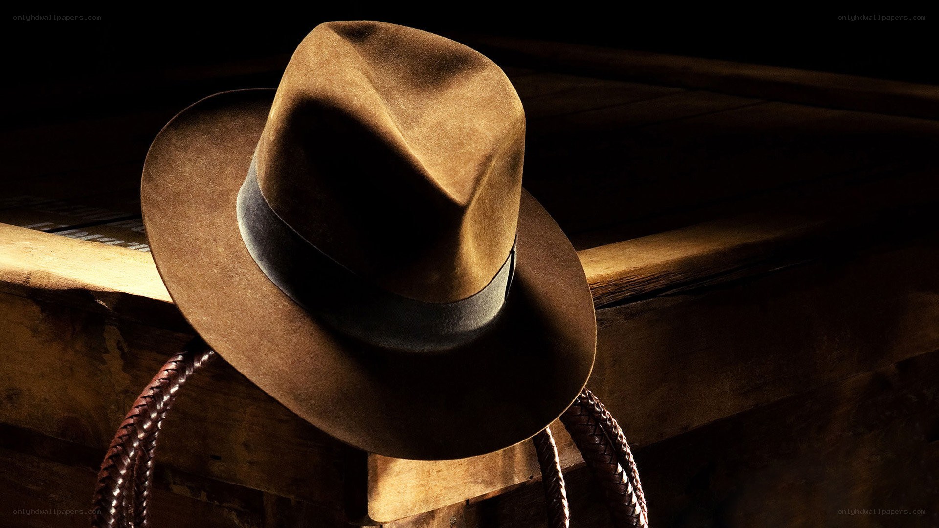 brown fedora hat on wood
