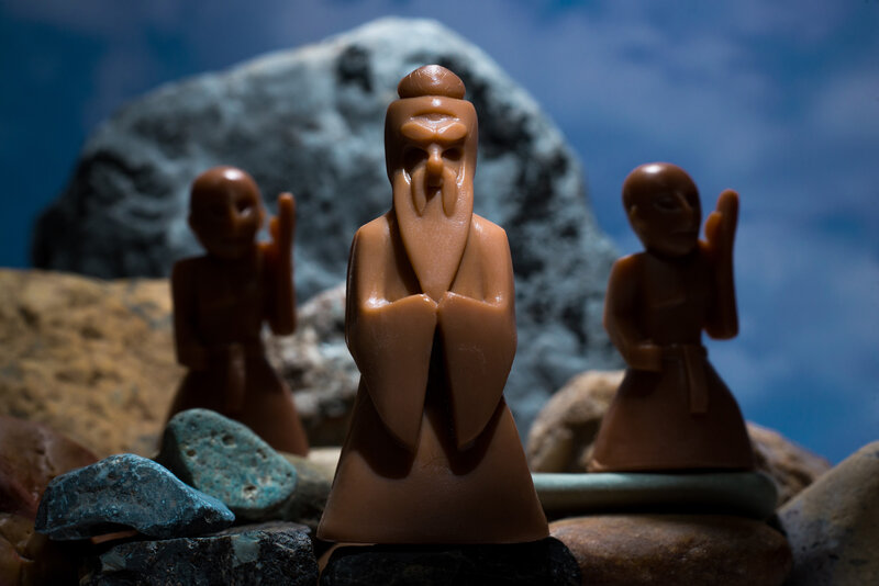 Brown Figurines on Rocks