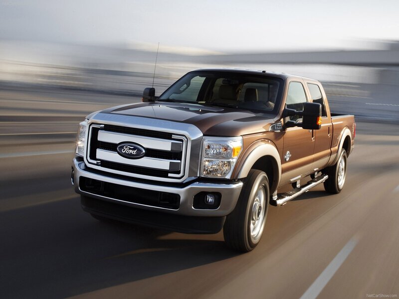Brown Ford F-250 driving on road
