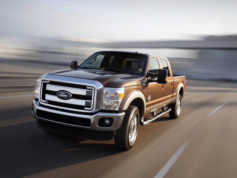 Brown Ford F-250 driving on road