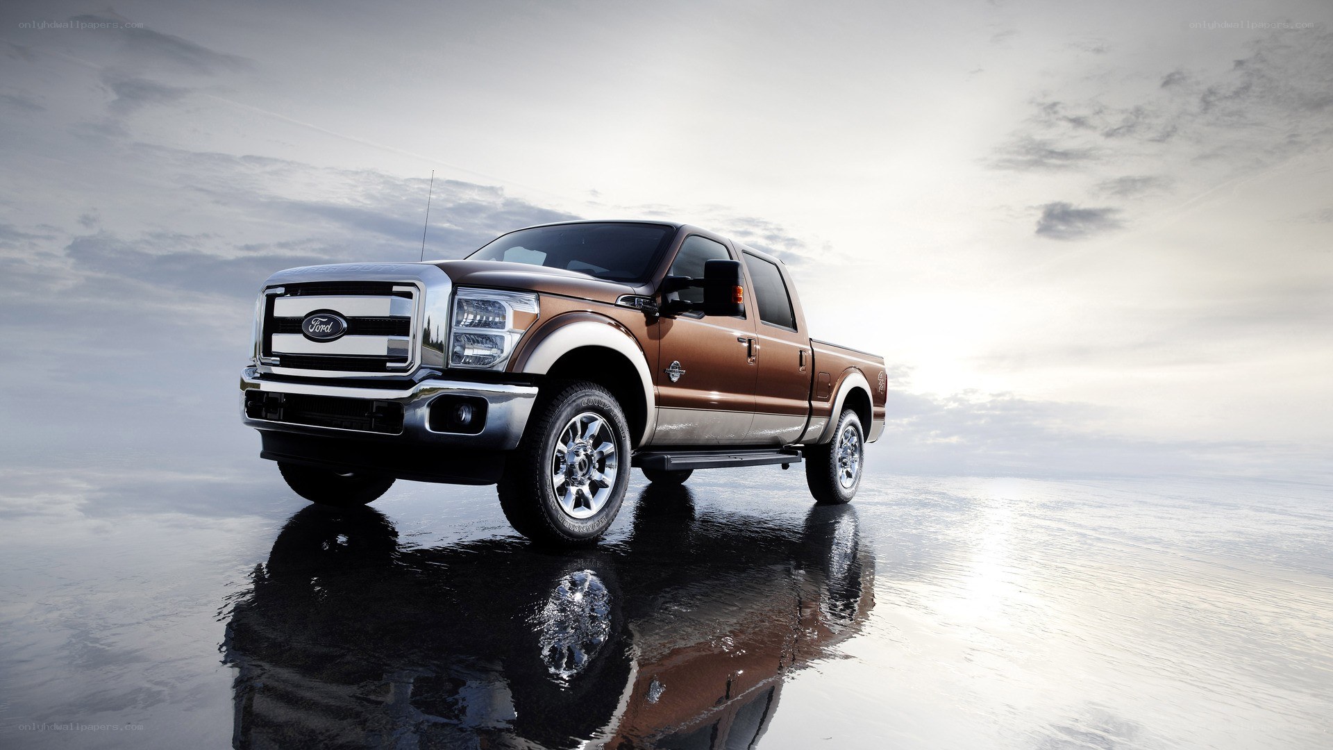 Brown Ford pickup truck on wet surface