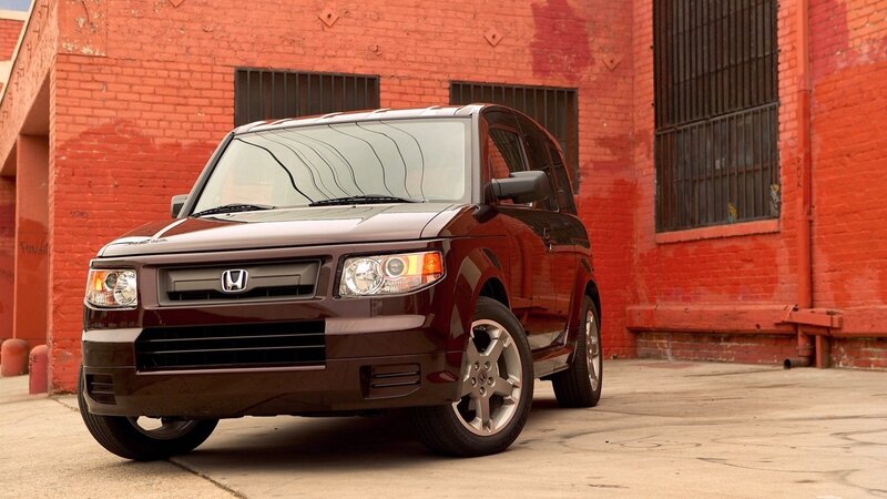 Brown Honda Element parked in alley