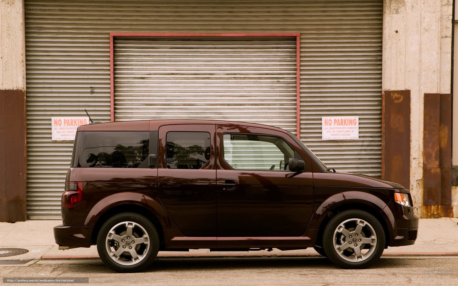 Brown Honda Element parked outside