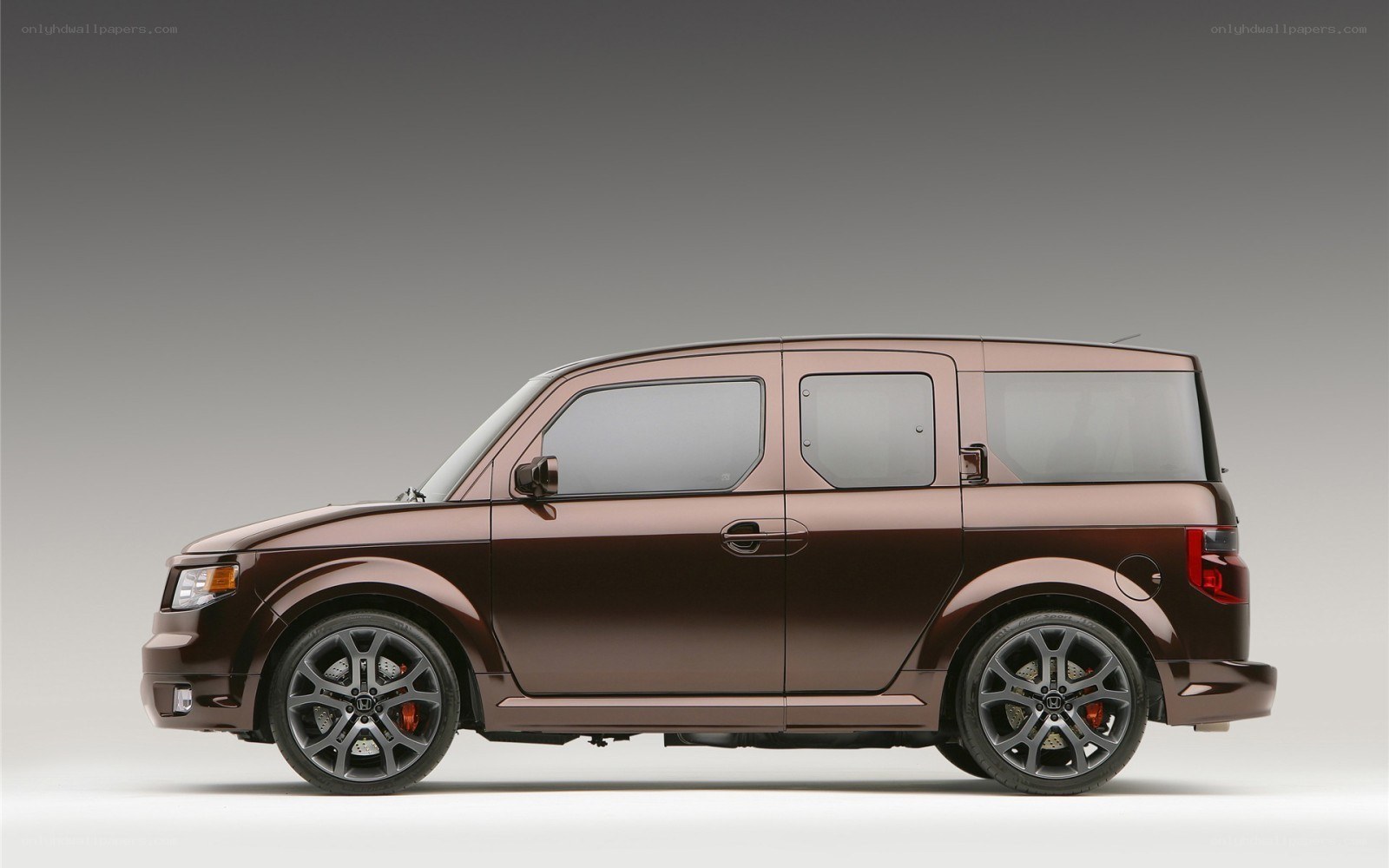 brown Honda Element side view