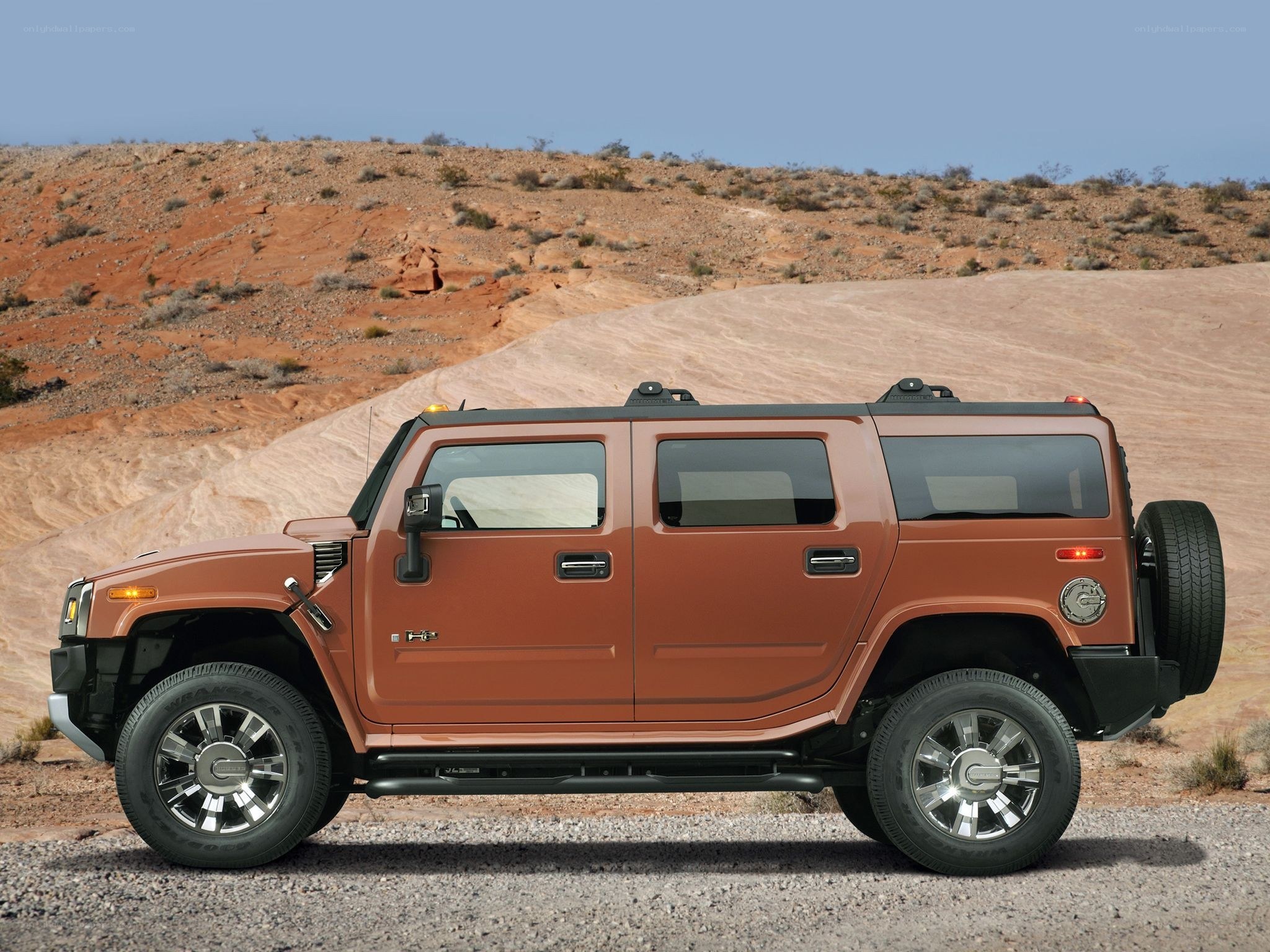 Brown Hummer H2 in desert