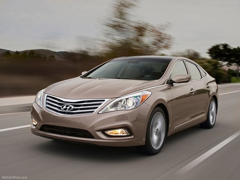 Brown Hyundai Azera in motion