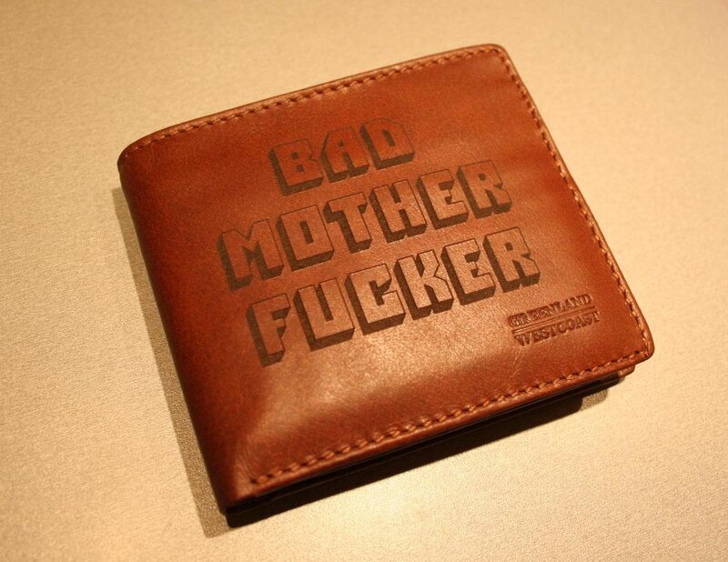 brown leather wallet with text