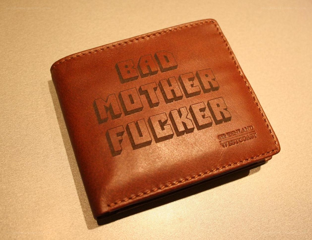brown leather wallet with text