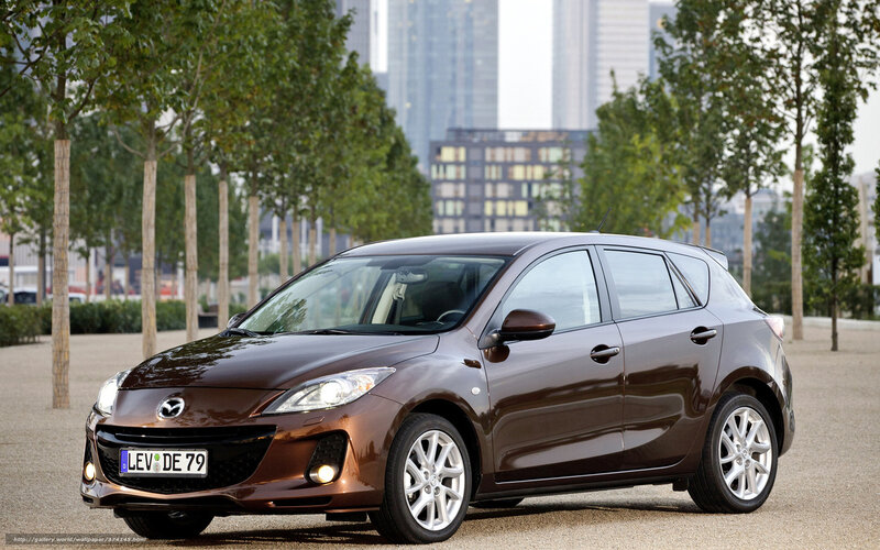 Brown Mazda 3 hatchback