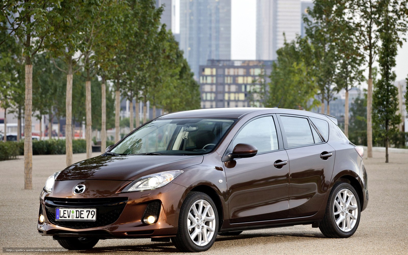 Brown Mazda 3 hatchback