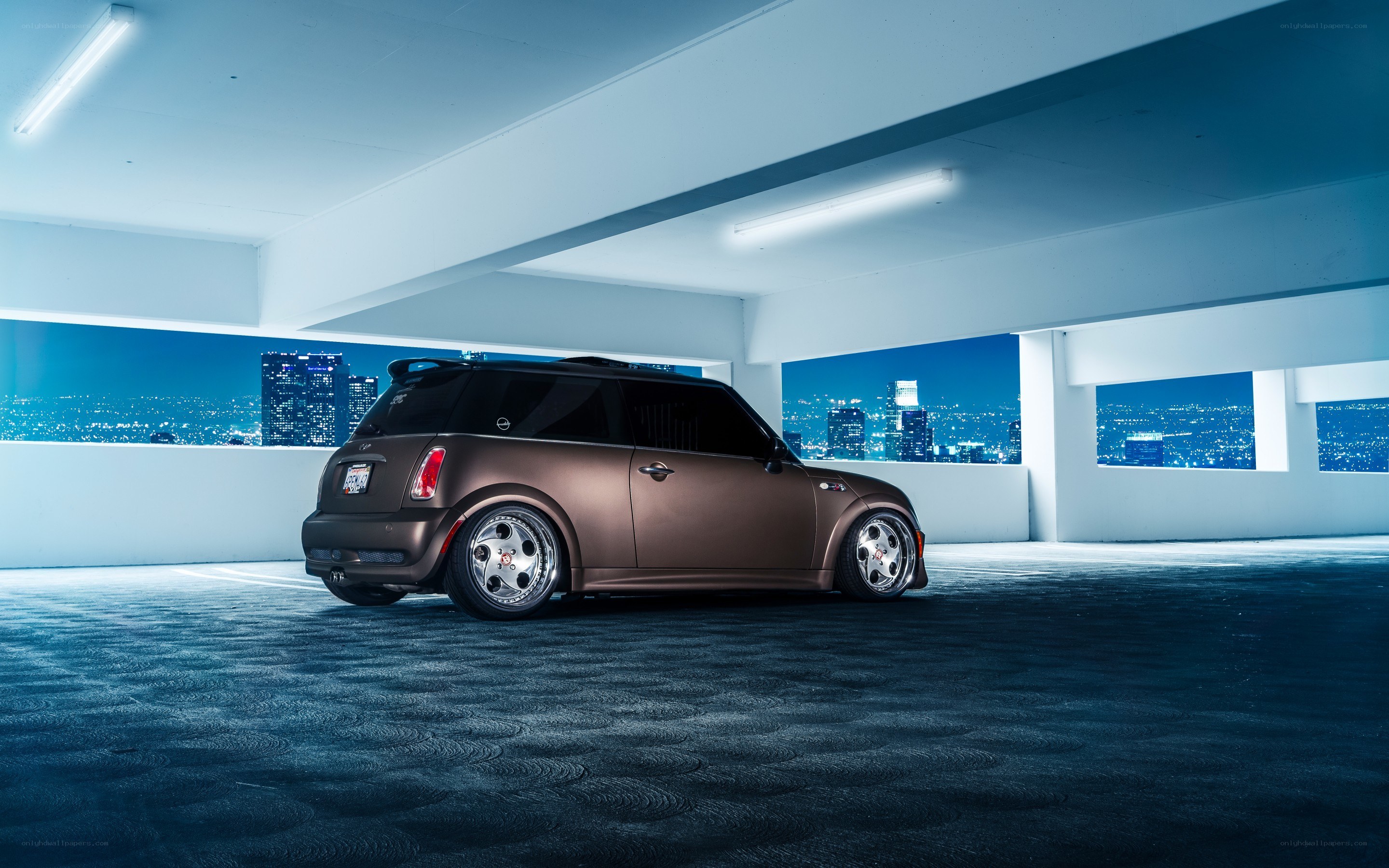 Brown Mini Cooper in parking garage