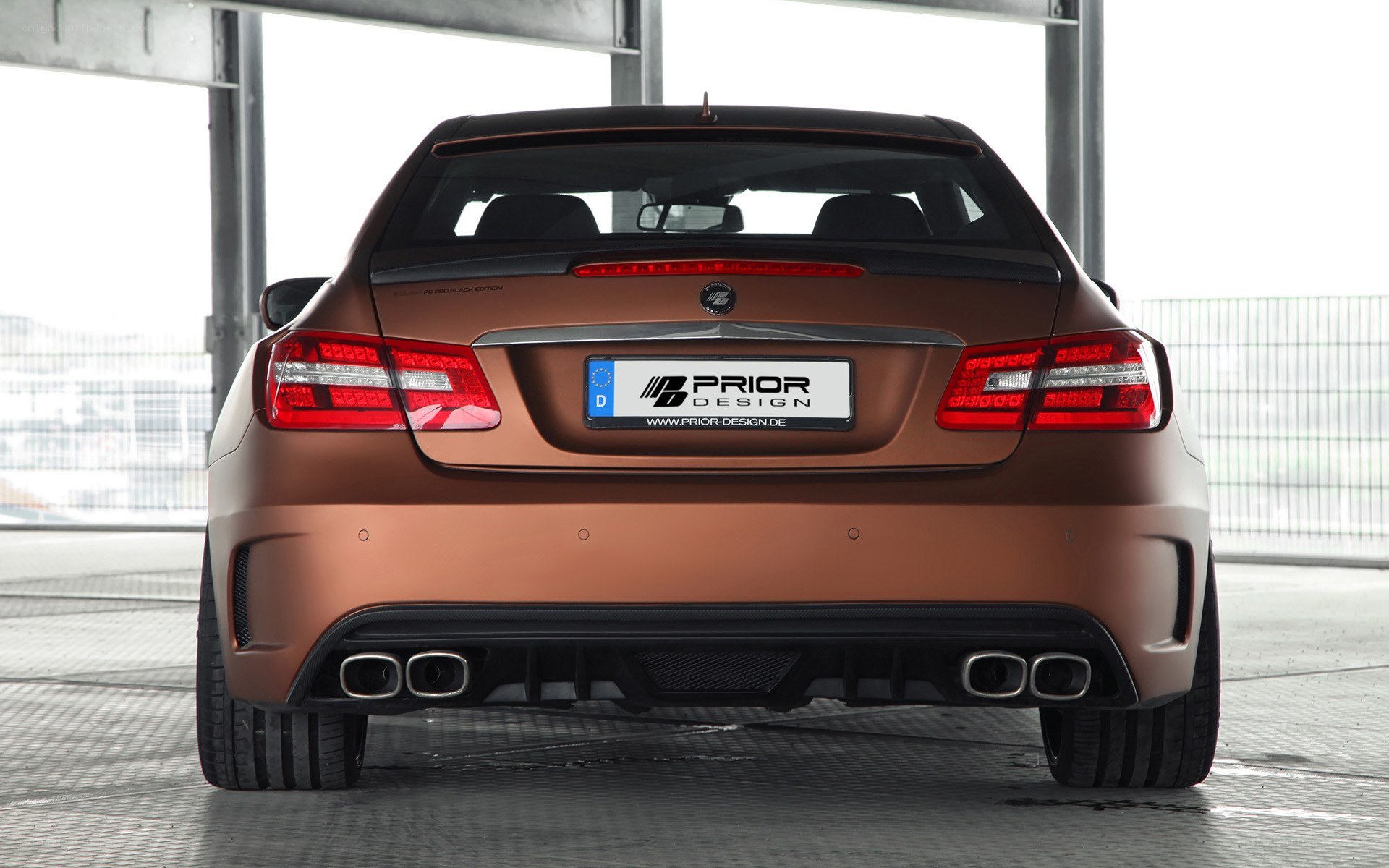 brown performance car rear view
