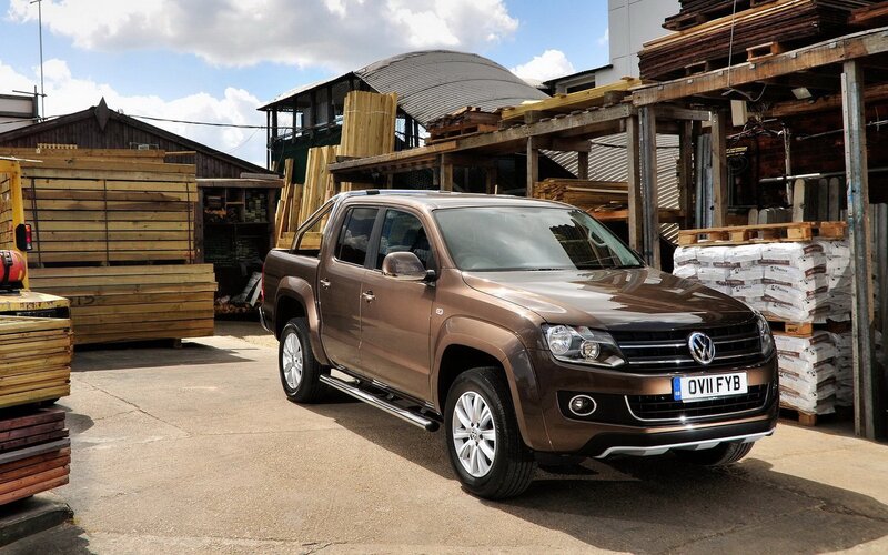 Brown pickup truck at a lumber yard